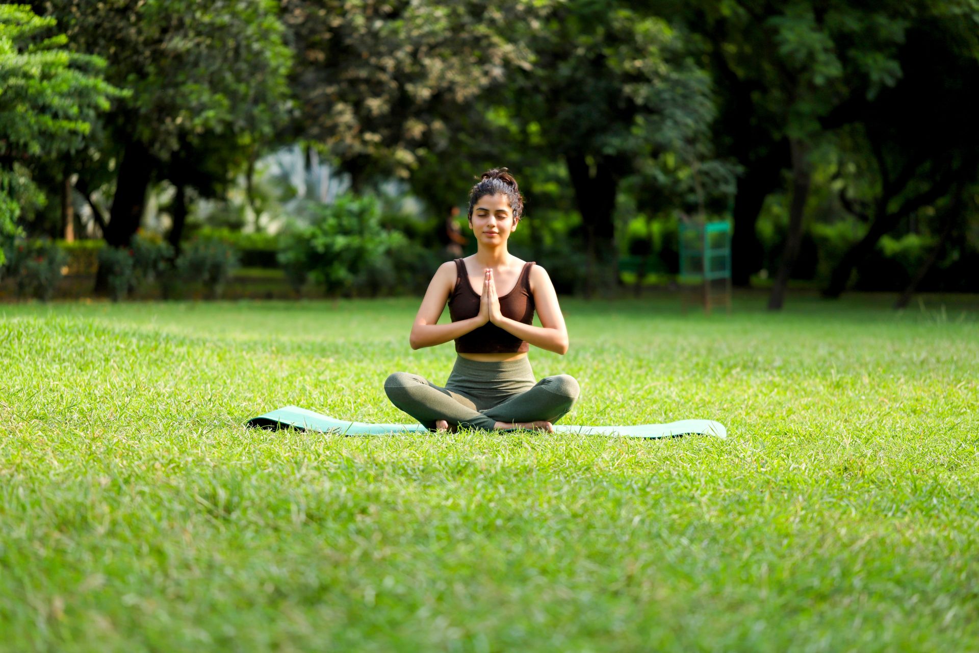 Woman meditating out in nature