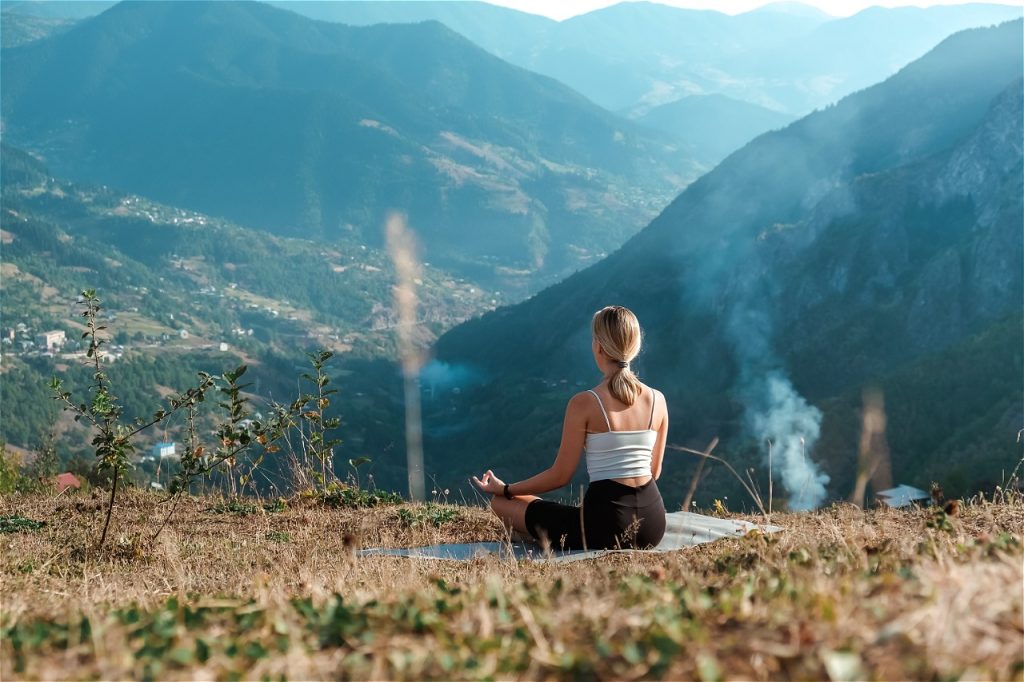 Woman meditating out in nature